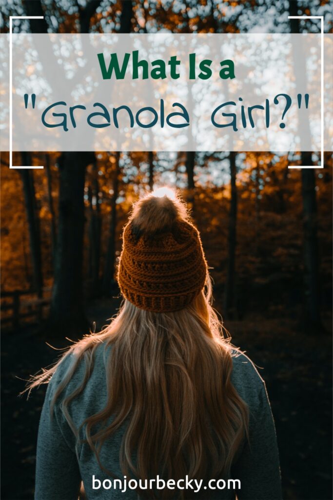 Photo of a blonde woman in an orange beanie facing away from the camera toward autumn trees. Text overlay reads "What is a Granola Girl?" Learn more at bonjourbecky.com.
