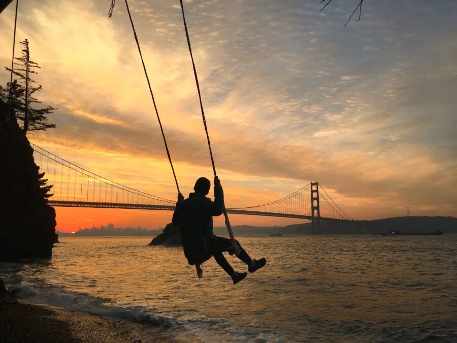 Kirby Cove swing at sunset with the Golden Gate Bridge